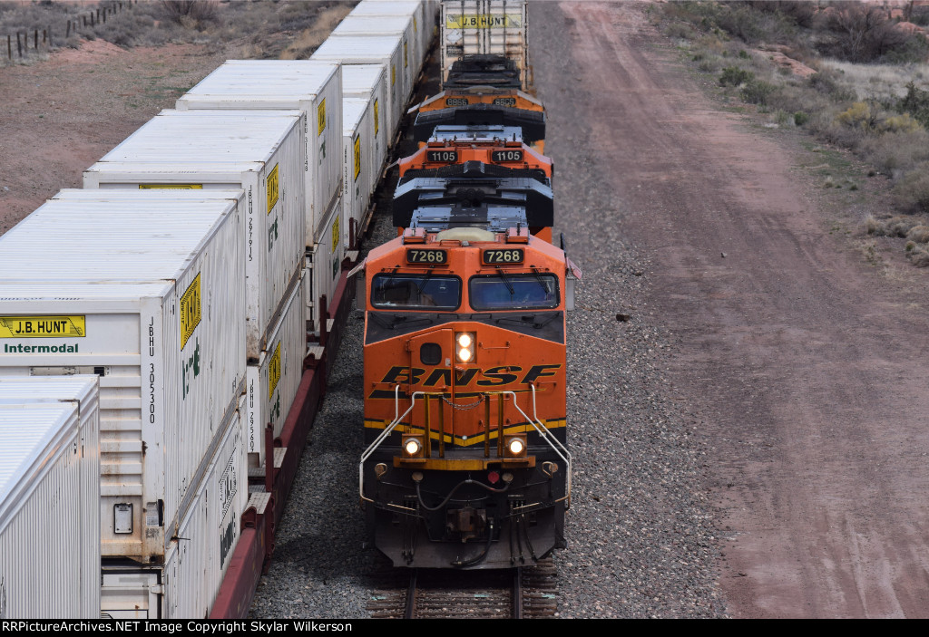 BNSF 7268, 1105, and 8866 highball under bridge in Petrified Forest NP